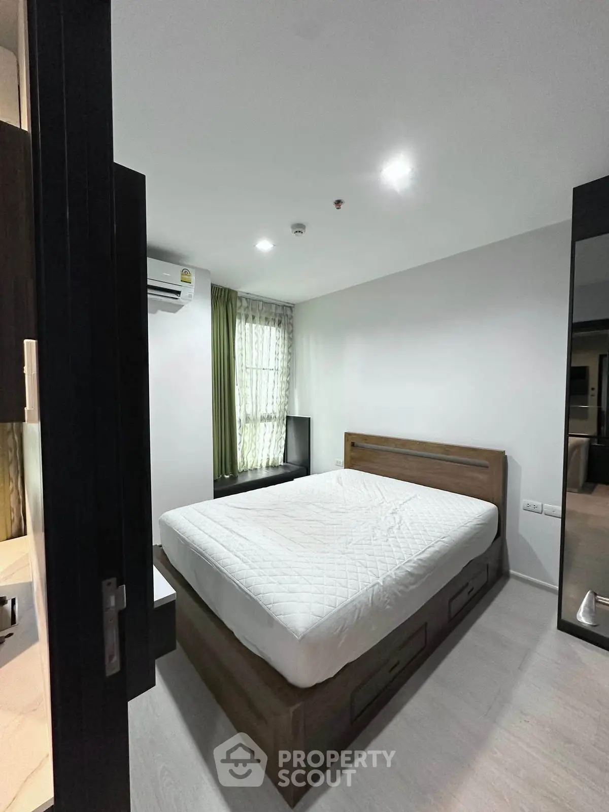 Modern bedroom with sleek design and ample natural light