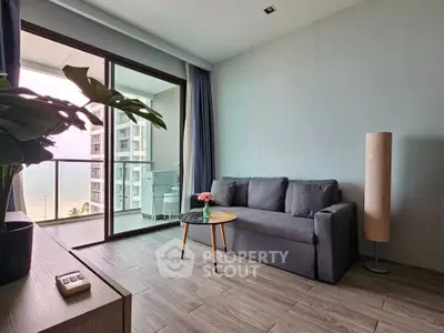 Modern living room with balcony and ocean view in a stylish apartment