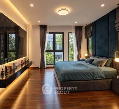 Luxurious bedroom with elegant decor and large windows offering a serene view.