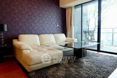 Luxurious living room with elegant sofa and stunning balcony view