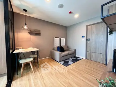 Modern living room with cozy sofa and dining area in stylish apartment