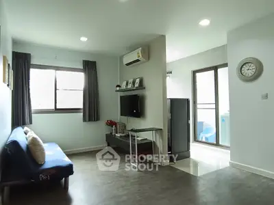 Modern living room with sleek design and balcony access