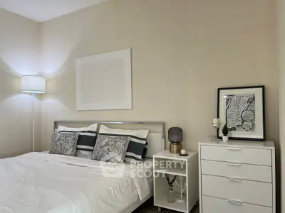 Cozy bedroom with modern decor and stylish furniture, perfect for a relaxing retreat.