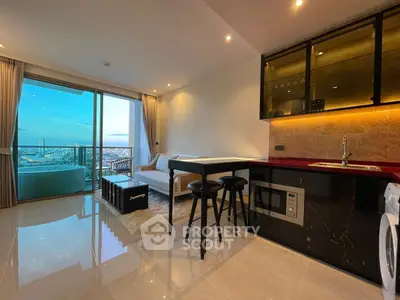 Modern open-plan living room with city view and sleek kitchen design.