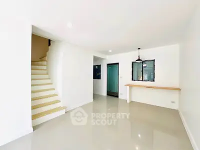 Spacious modern interior with staircase and sleek design
