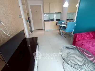 Modern living room with vibrant decor and open kitchen layout