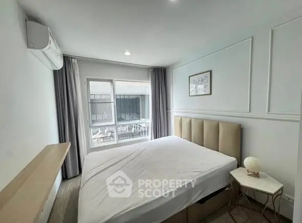 Modern bedroom with large window and minimalist decor