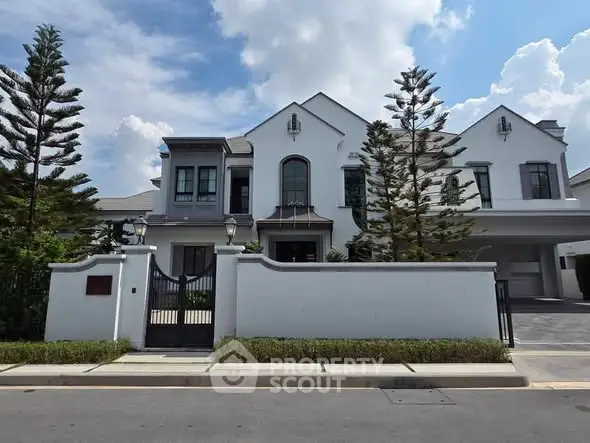 Stunning modern house with elegant facade and lush landscaping, perfect for luxury living.