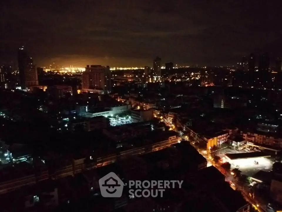Stunning cityscape night view with illuminated skyline and vibrant urban lights.