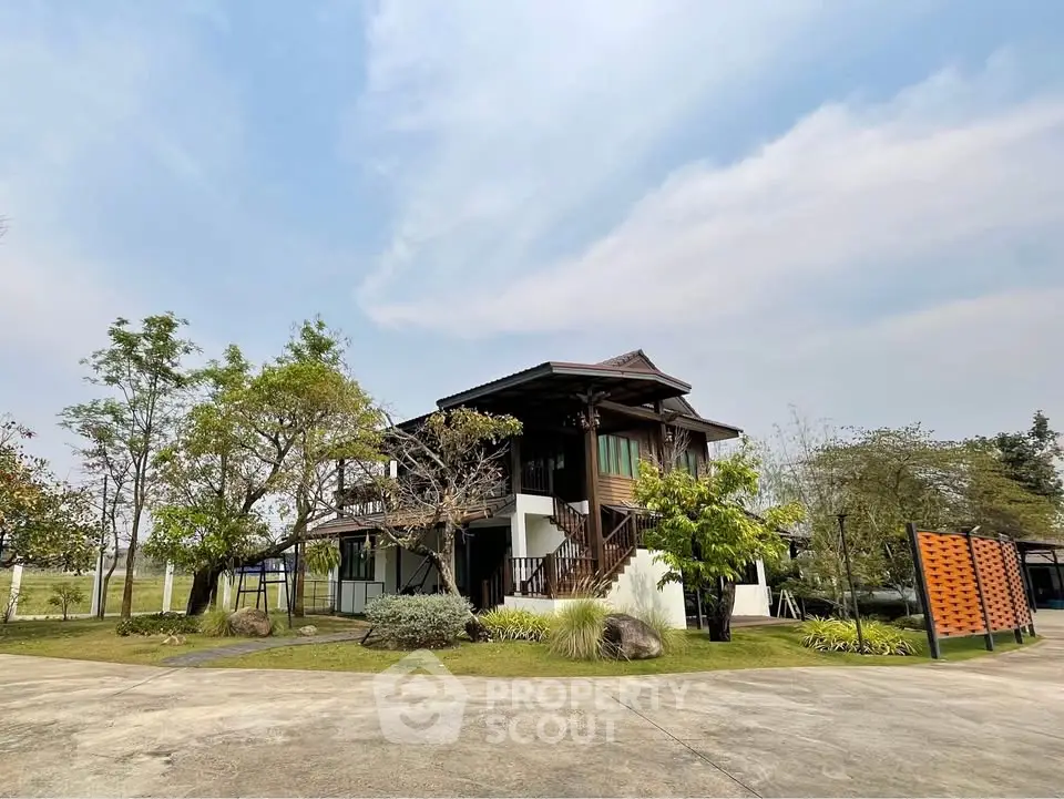 Charming two-story house with lush garden and spacious driveway in serene neighborhood.