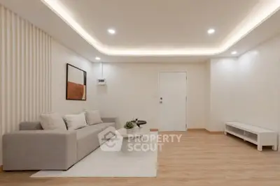 Modern minimalist living room with cozy gray sofa and stylish decor