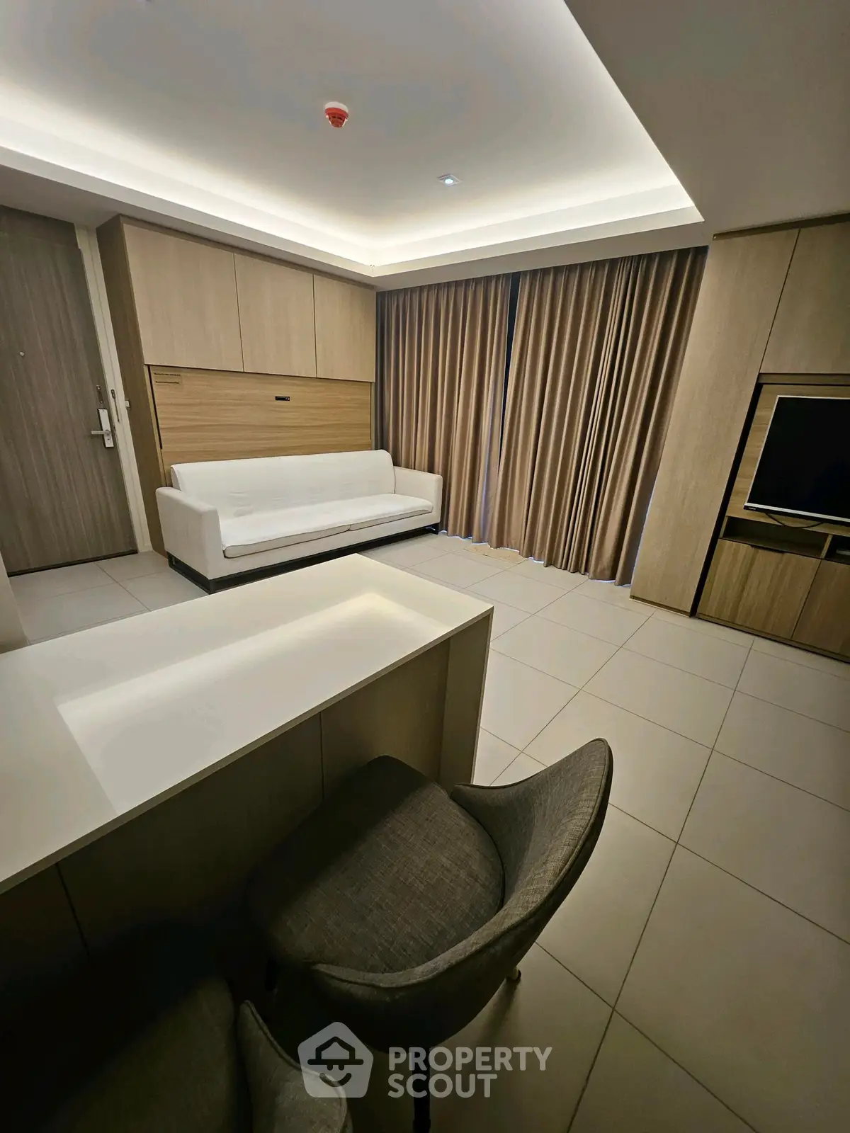 Modern living room with sleek furniture and ambient lighting