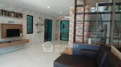 Modern living room with stylish brick walls and open shelving
