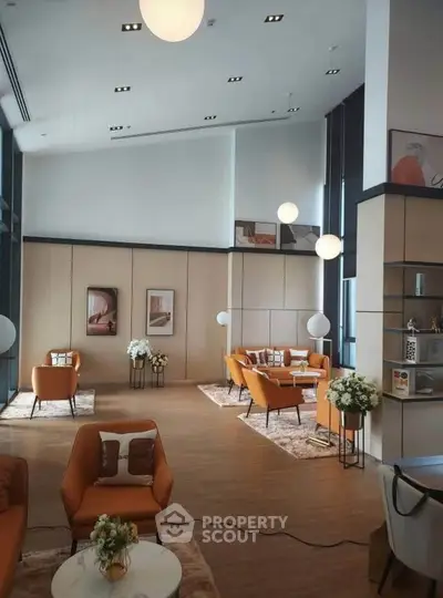 Luxurious modern living room with high ceilings and elegant decor, perfect for sophisticated gatherings.