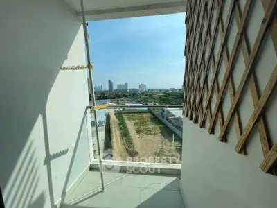 Charming balcony with city view, perfect for relaxation and enjoying the skyline.