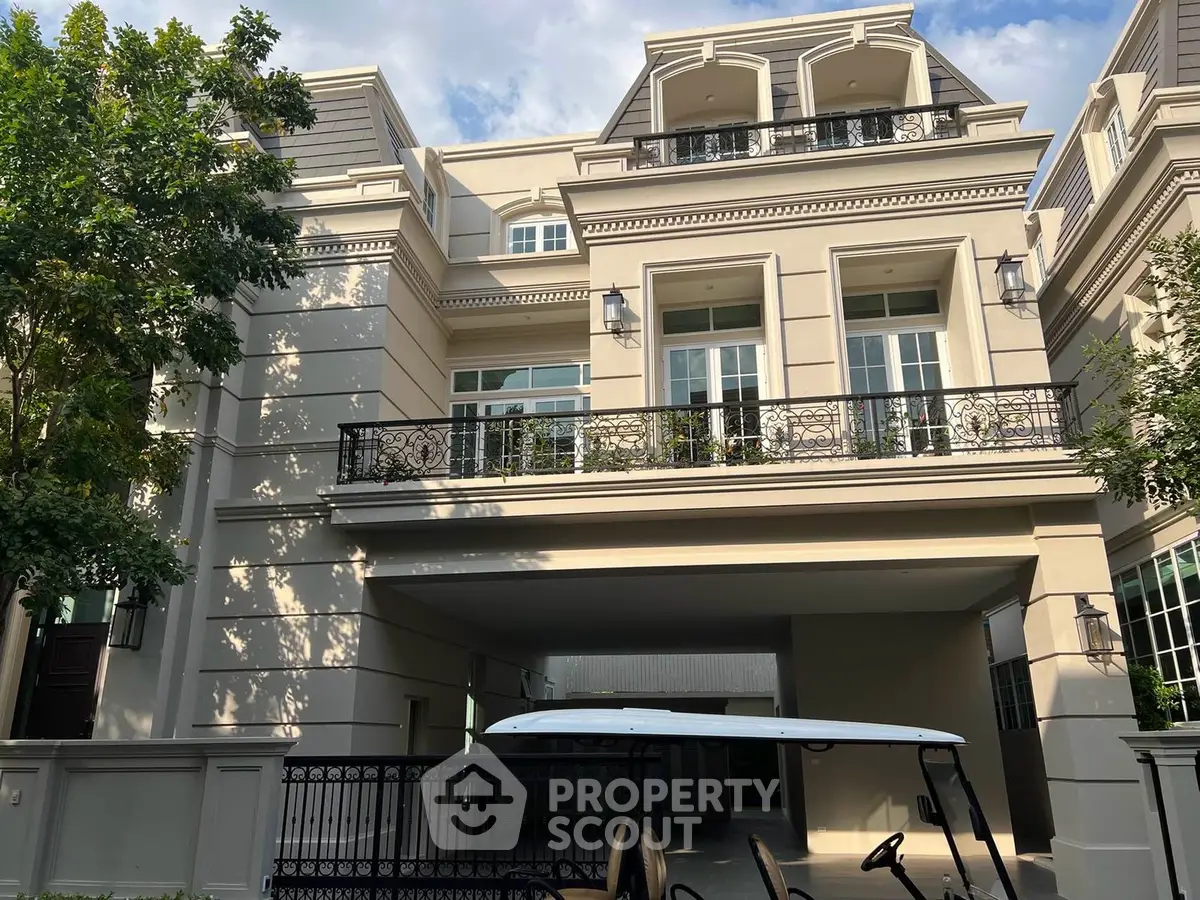 Luxurious multi-story building with elegant facade and lush greenery, perfect for upscale living.