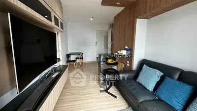 Modern living room with sleek wooden accents and cozy seating area.