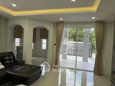 Modern living room with sliding glass doors and elegant curtains