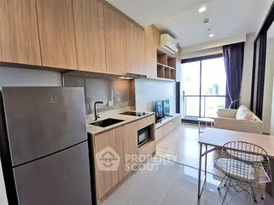 Modern open-layout kitchen and living room with balcony view
