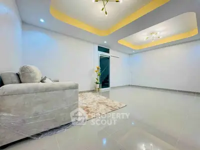 Spacious modern living room with elegant lighting and plush sofa