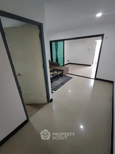 Spacious modern apartment with sleek flooring and open layout