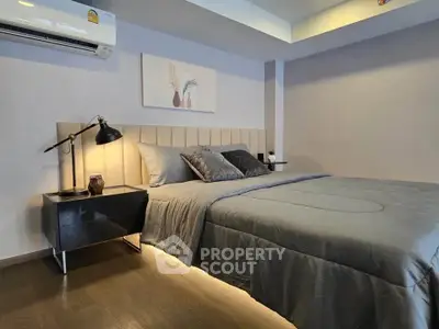 Modern bedroom with stylish decor and ambient lighting