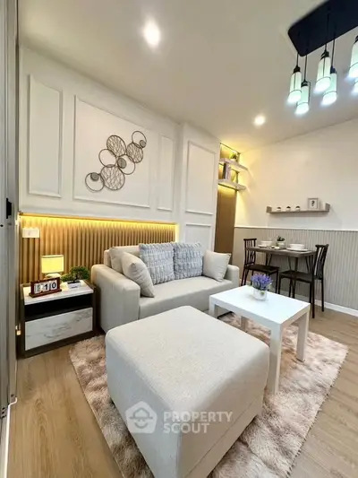 Chic modern living room with cozy sofa, stylish decor, and elegant lighting in a contemporary apartment.