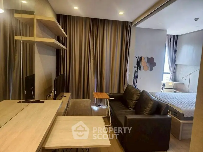 Modern studio apartment with cozy living area and stylish decor