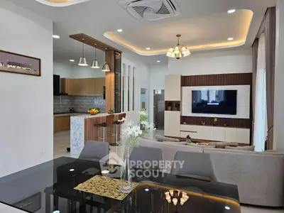 Modern open-plan living room with stylish kitchen and elegant decor