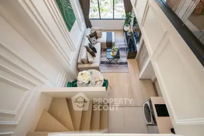 Luxurious loft-style living room with modern decor and large windows offering stunning views.