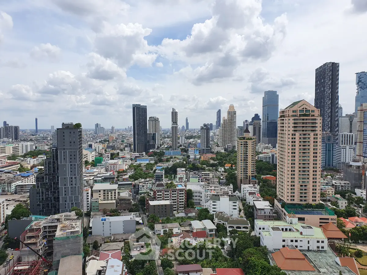 Stunning cityscape view showcasing modern skyscrapers and urban landscape under a cloudy sky.