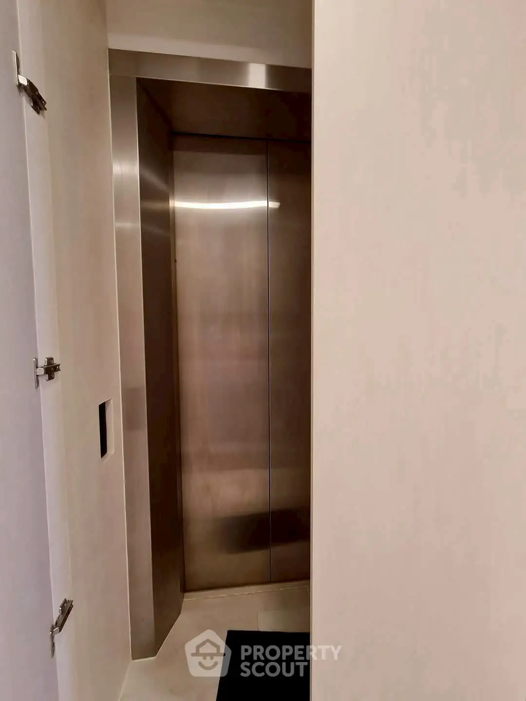 Modern elevator entrance in a sleek residential building