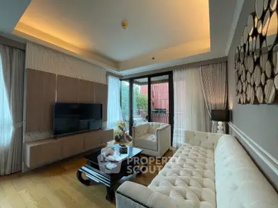 Luxurious living room with elegant decor and large windows offering natural light