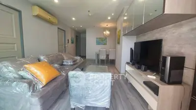 Modern living room with sleek furniture and entertainment setup