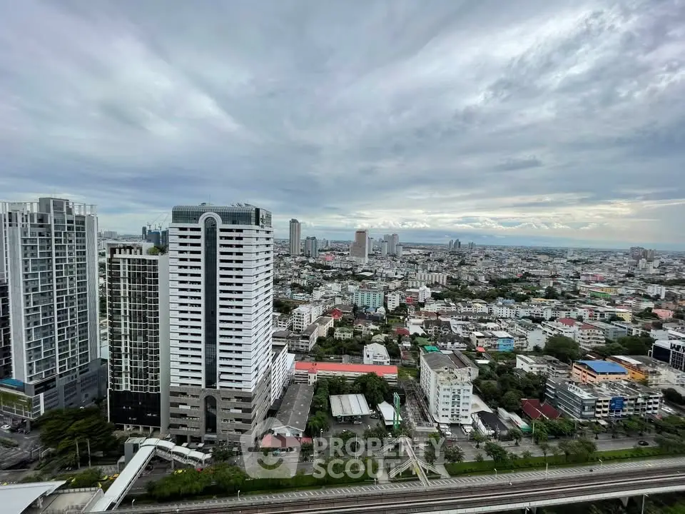 Stunning cityscape view from high-rise building showcasing urban skyline and architectural diversity.