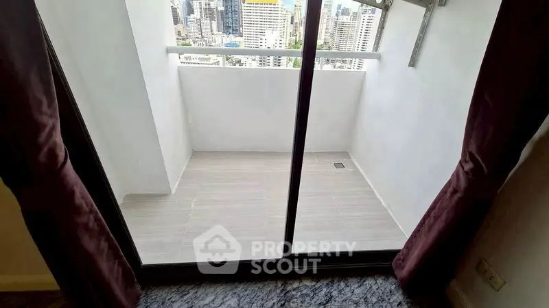 Spacious balcony with city view in modern apartment