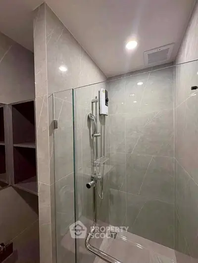 Modern bathroom with sleek glass shower and elegant tile design