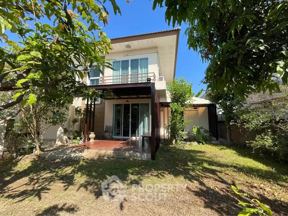 Charming two-story house with lush garden and spacious balcony, perfect for family living.