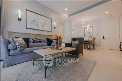 Elegant living room with modern decor and cozy seating area in a stylish apartment.