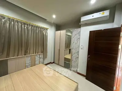 Modern bedroom with air conditioning and stylish decor