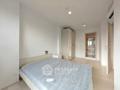 Modern bedroom with minimalist design and ample natural light