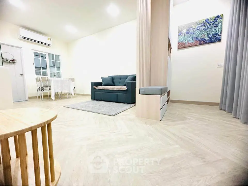 Spacious modern living room with elegant decor and stylish furniture, perfect for relaxation and entertainment.