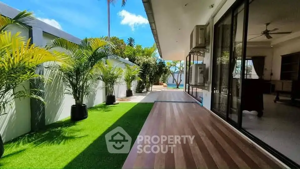 Stunning modern home with lush garden and spacious outdoor area, perfect for relaxation and entertainment.