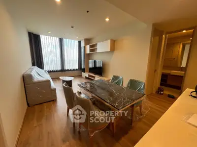 Modern living room with dining area and large window view