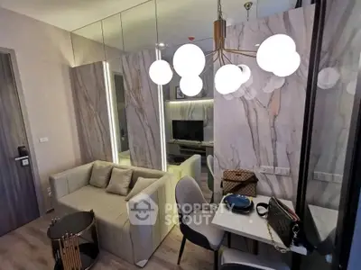 Modern living room with stylish decor and elegant lighting in a contemporary apartment.