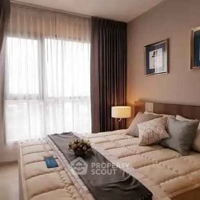 Cozy and elegant bedroom with large window and stylish decor