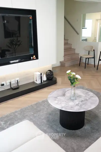 Modern living room with stylish decor and elegant marble coffee table