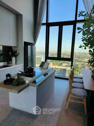 Stunning modern kitchen with panoramic city view, featuring sleek design and open layout for luxury living.