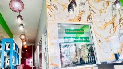 Modern interior with marble walls and stylish lighting in a vibrant commercial space.