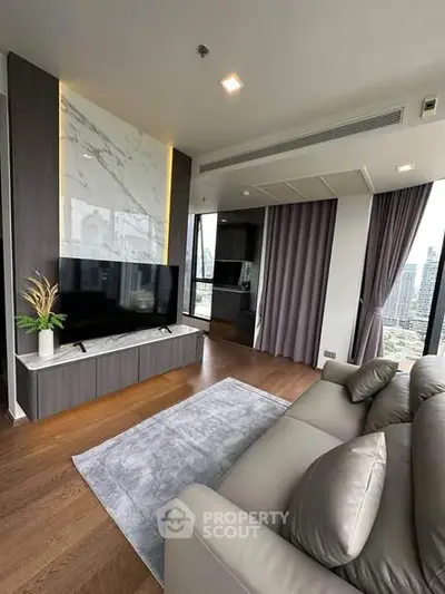 Luxurious modern living room with city view, featuring sleek design and elegant furnishings.